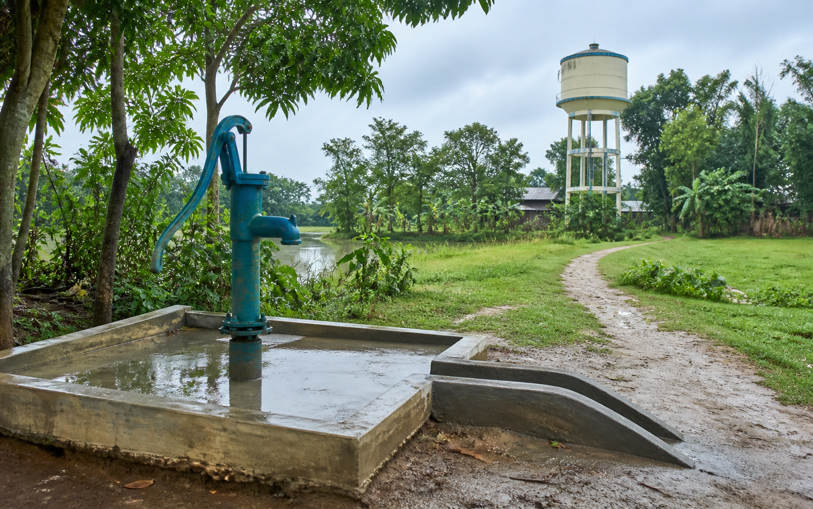 Representative maintained rural water source with a village water tank